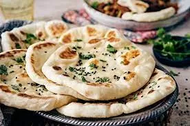 Foto Roti Tradisional Naan/https://www.kingarthurbaking.com/sites/default/files/styles/featured_image/public/2021-02/naan-3.jpg?itok=xPP3zs5s 