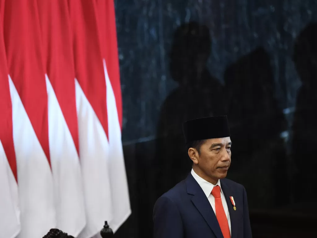 Presiden Joko Widodo dalam upacara pelantikan di Gedung Nusantara, kompleks Parlemen, Senayan, Jakarta, Minggu (20/10). (Antara/Akbar Nugroho Gumay)