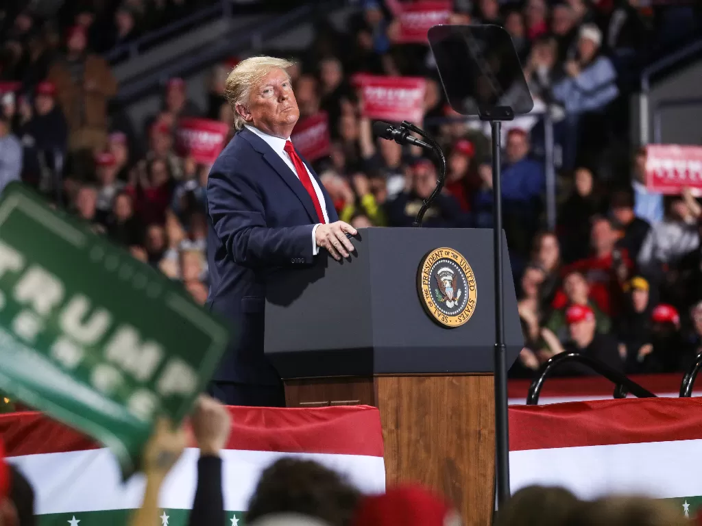 Donald Trump saat berkampanye di Michigan, Rabu (18/12). (Reuters/Leah Millis)