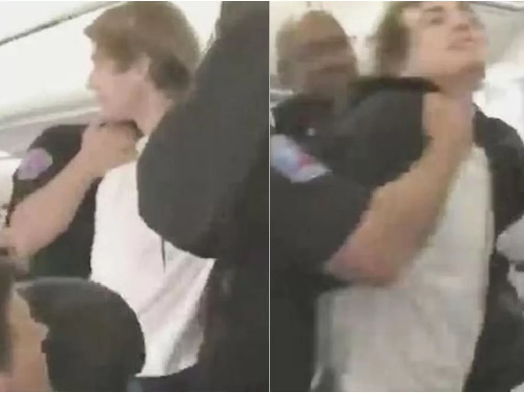 Seorang penumpang bikin onar di penerbangan American Airlines. (Tangkapan layar/Twitter)