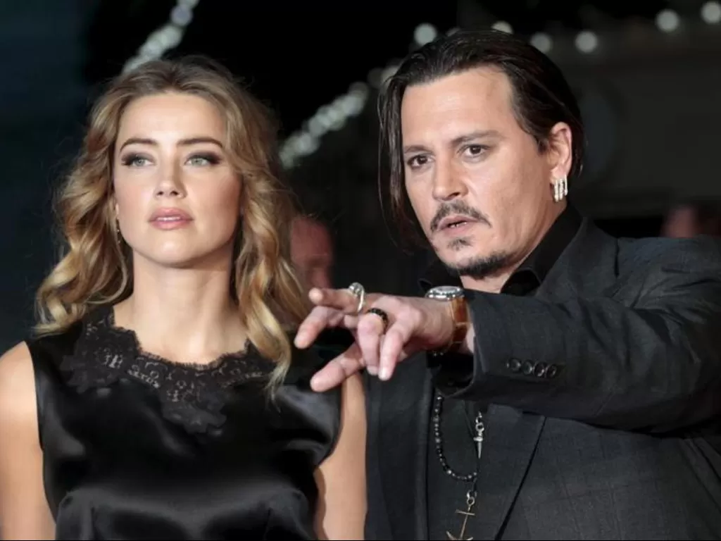 Amber Heard dan Johny Depp. (REUTERS/Suzanne Plunkett)