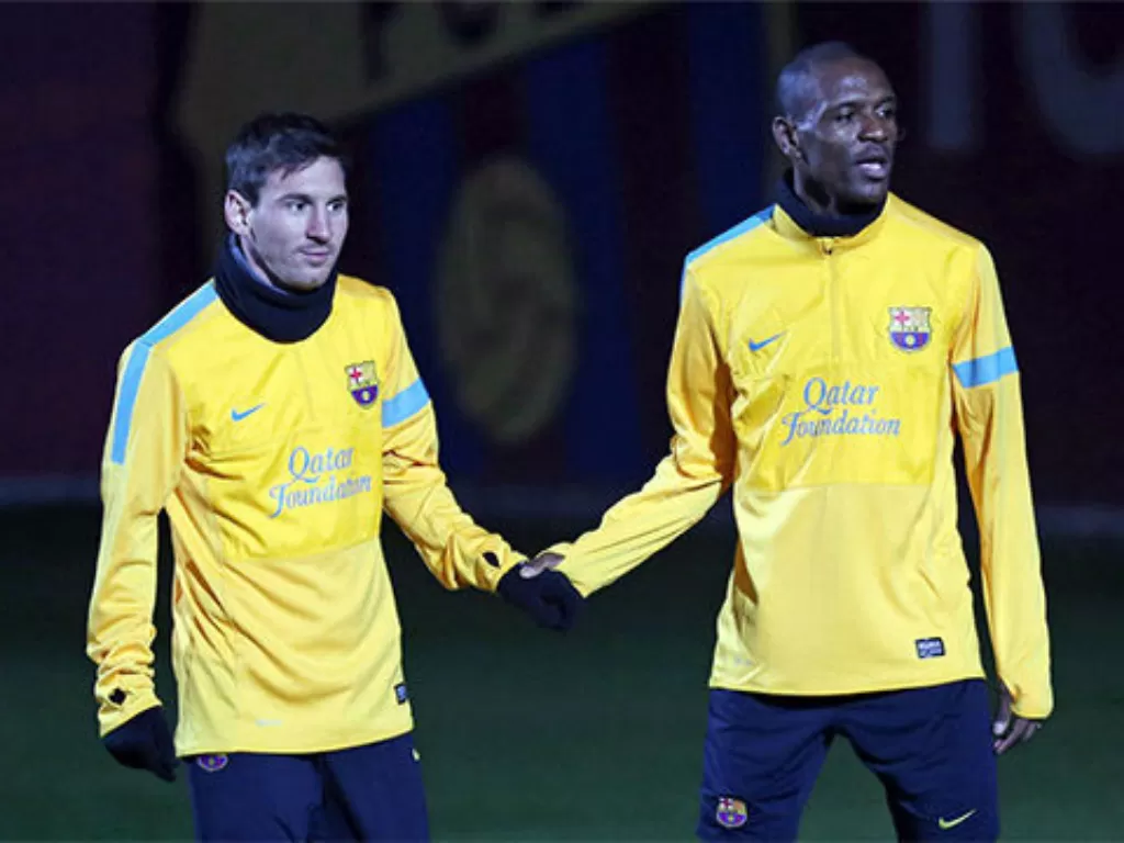 Lionel Messi dan Erick Abidal. (photo/sport.es)
