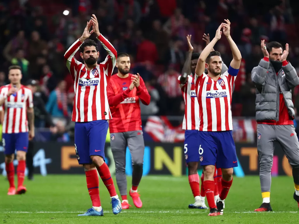 Pemain Atletico Madrid merayakan kemenangan setelah mengalahkan Liverpool. (REUTERS/Sergio Perez)