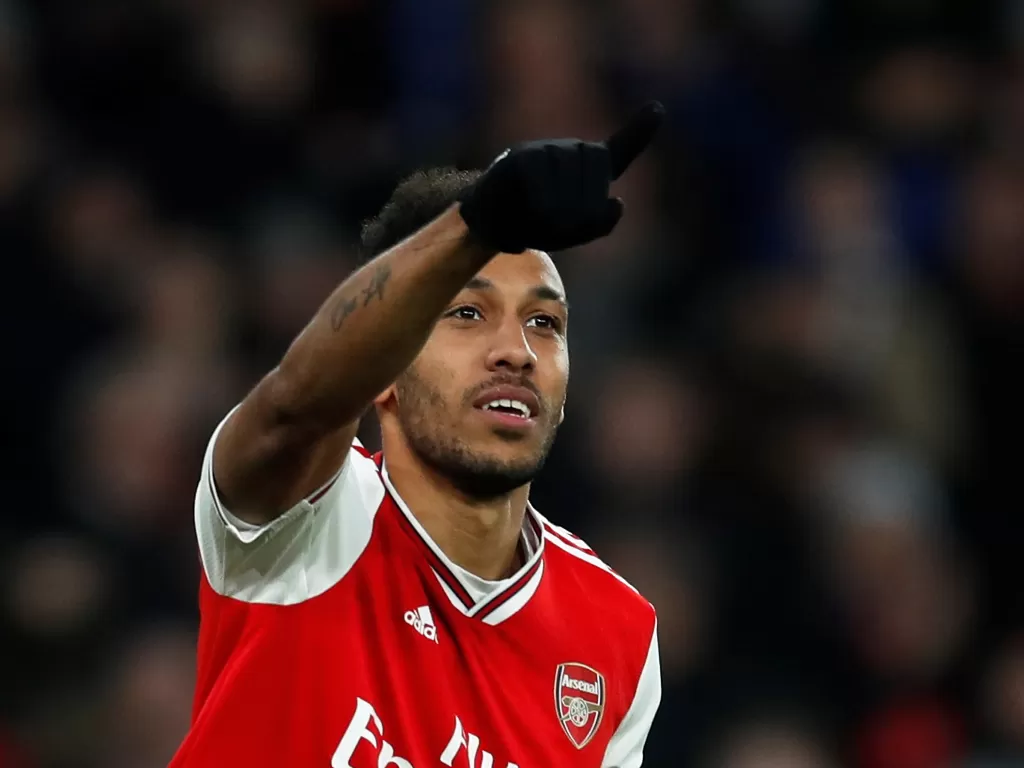 Penyerang Arsenal, Pierre-Emerick Aubameyang yang sedang melakukan selebrasi usai mencetak gol. (REUTERS/David Klein)