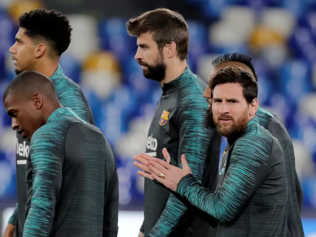 (Bek Barcelona, Gerard Pique dan penyerang Barcelona, Lionel Messi. REUTERS/Ciro De Luca)
