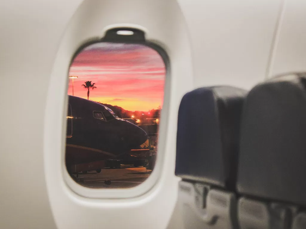 Ilustrasi jendela kabin pesawat. (Pexels)