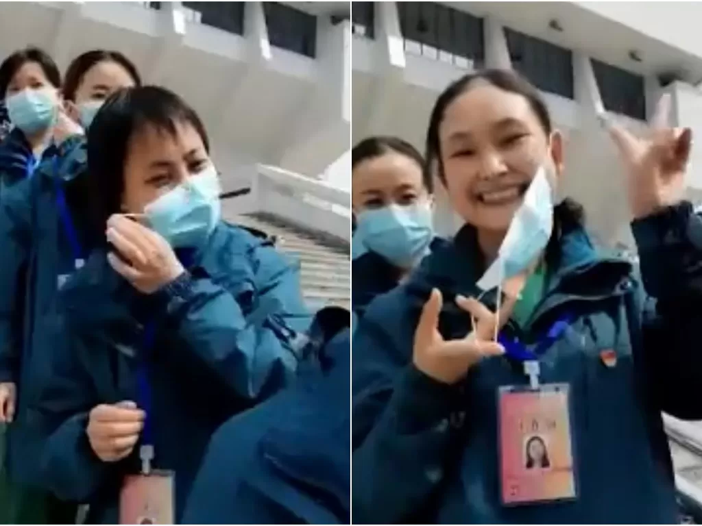 Para petugas medis di Wuhan, Tiongkok, melambaikan tangan dan tersenyum bahagia sambil melepas masker (Screenshot)