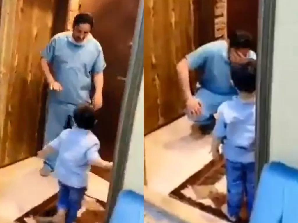 Seorang dokter di Arab Saudi yang menangis karena tidak bisa memeluk anaknya. (photo/Twitter/@Doranimated)