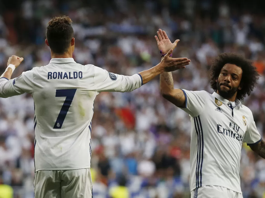 Cristiano Ronaldo dan Marcelo saat masih satu tim di Real Madrid. (REUTERS/Sergio Perez)