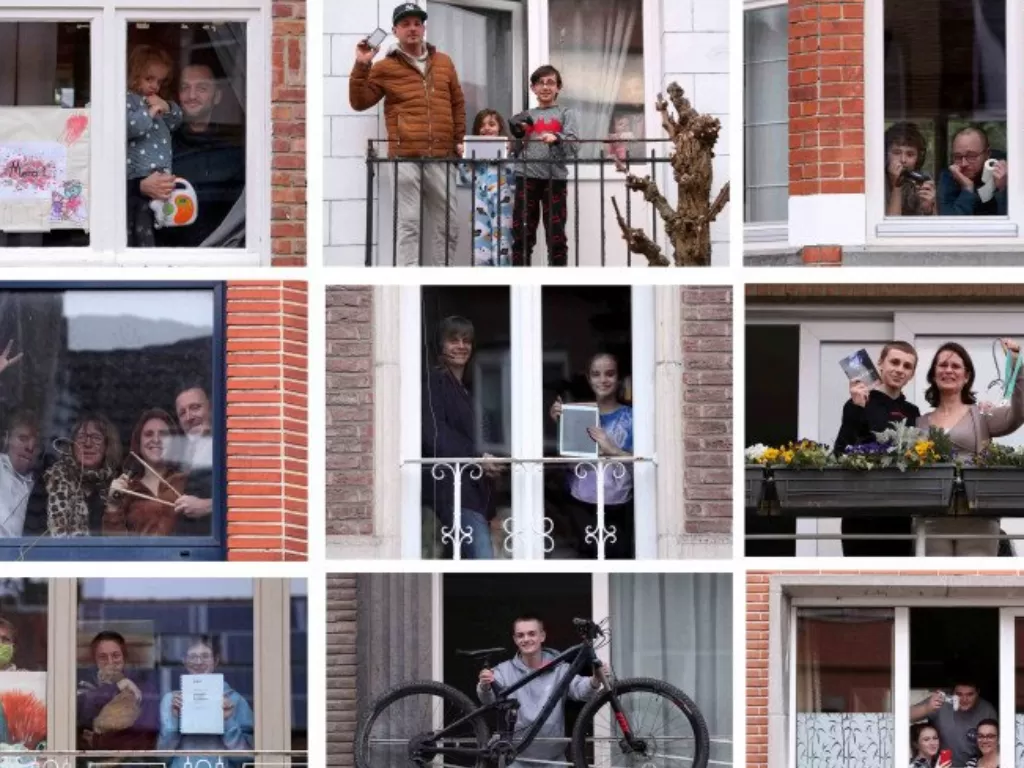 Foto kombinasi sejumlah warga berpose di balkon dan jendela rumahnya sambil memegang benda kesayangannya saat masa 'lockdown' yang diberlakukan Pemerintah Belgia dalam upaya menekan penyebaran Covid-19. (ANTARA/Yves Herman)