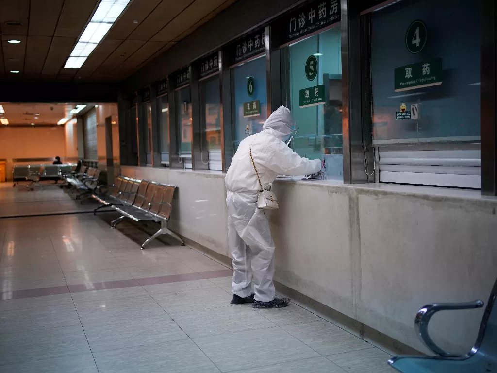 Ilustrasi seorang perawat Covid-19 di Wuhan. (photo/Ilustrasi/REUTERS/Aly Song)