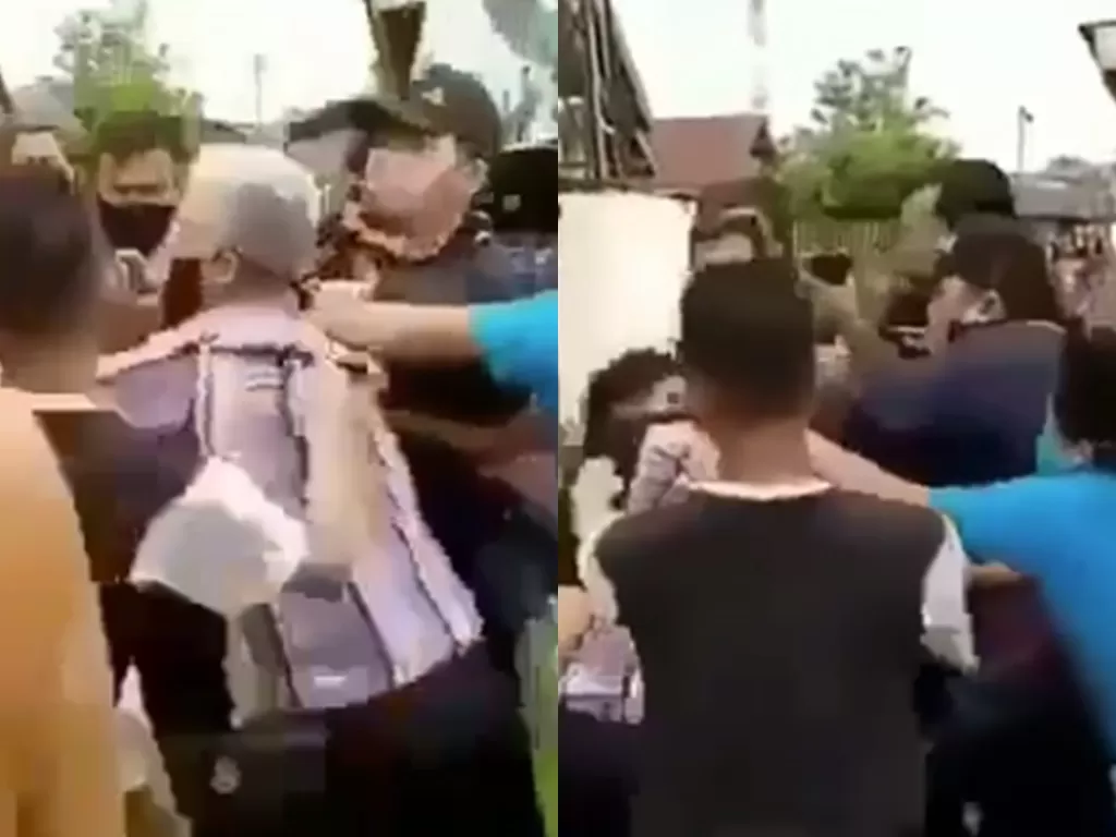 Potongan video saat ketua RT adu jotos dengan ojol ketika pembagian sembako. (photo/Istimewa)