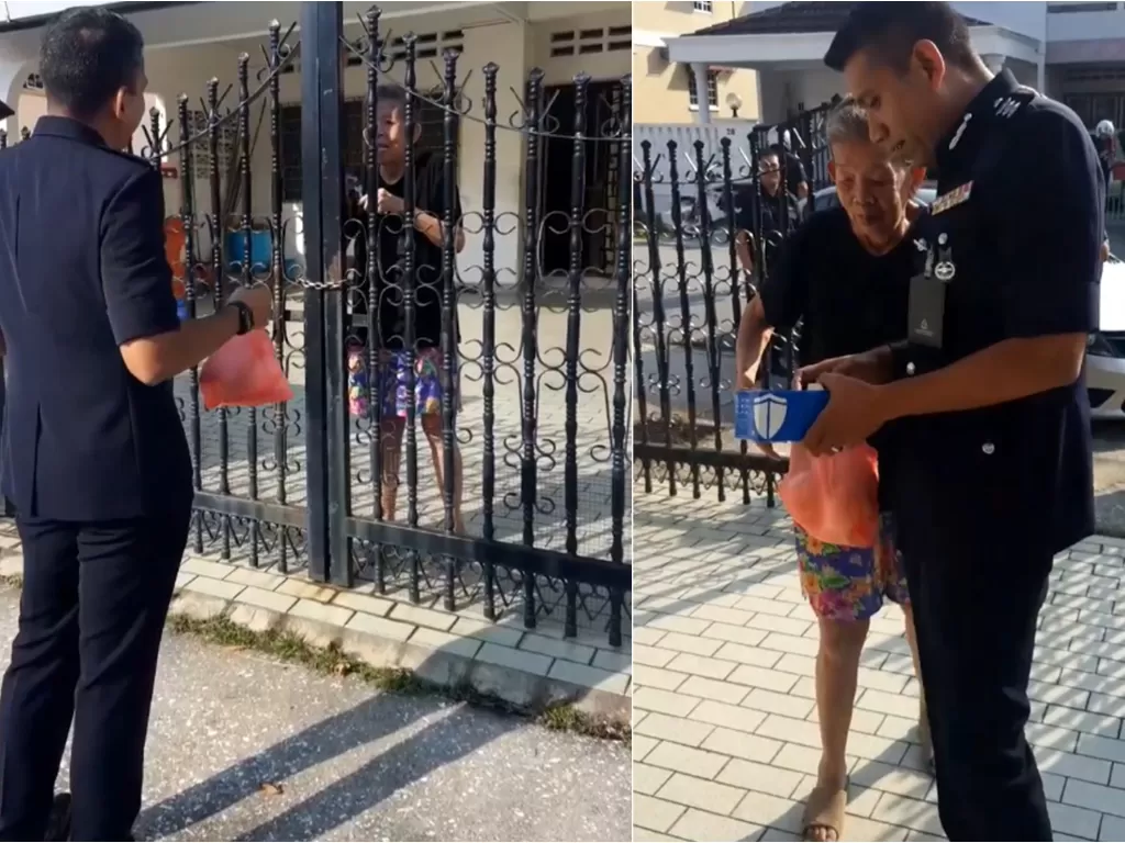 Polisi saat bertemu dengan wanita tua yang sering memberinya bakpao. (Facebook/Polis Daerah Petaling Jaya)