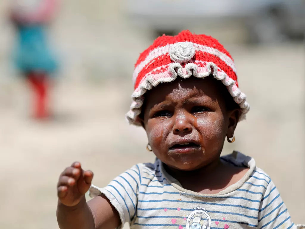 Seorang anak menangis karena kelaparan. (Photo/Ilustrasi/REUTERS/Khaled Abdullah)
