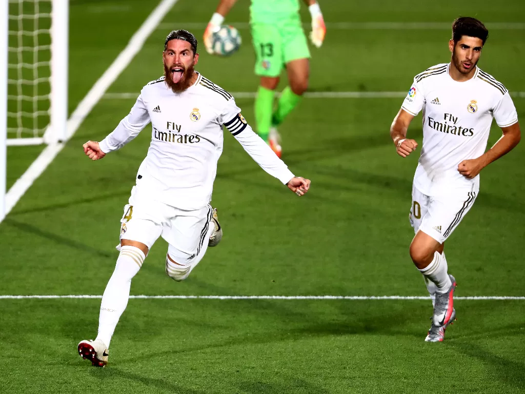 Sergio Ramos melakukan selebrasi usai mencetak gol dalam laga Real Madrid vs Getafe. (photo/REUTERS/ SERGIO PEREZ)