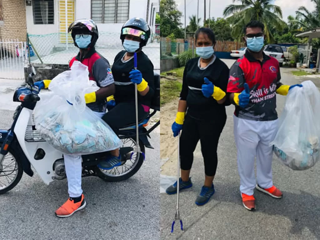 Kakak beradik yang viral karena melakukan aksi membersihkan sampah masker di jalanan. (photo/Facebook/Vasugi Ramasamy)