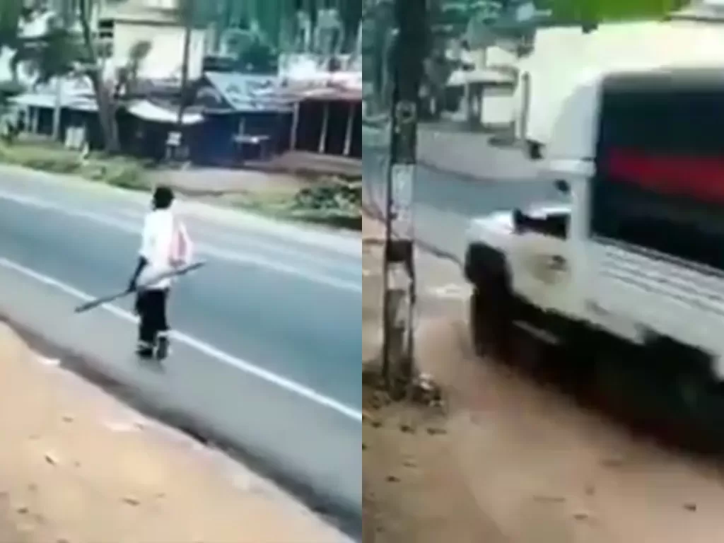 Seorang pria yang nyaris ditabrak truk saat sedang berjalan di tepi jalan. (photo/Instagram/Istimewa)