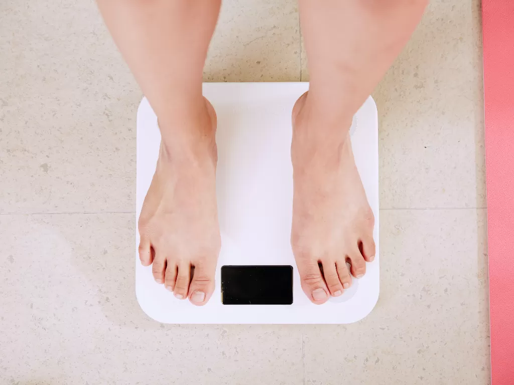 Ilustrasi kesulitan mengatur berat badan (Unsplash/i yunmai)
