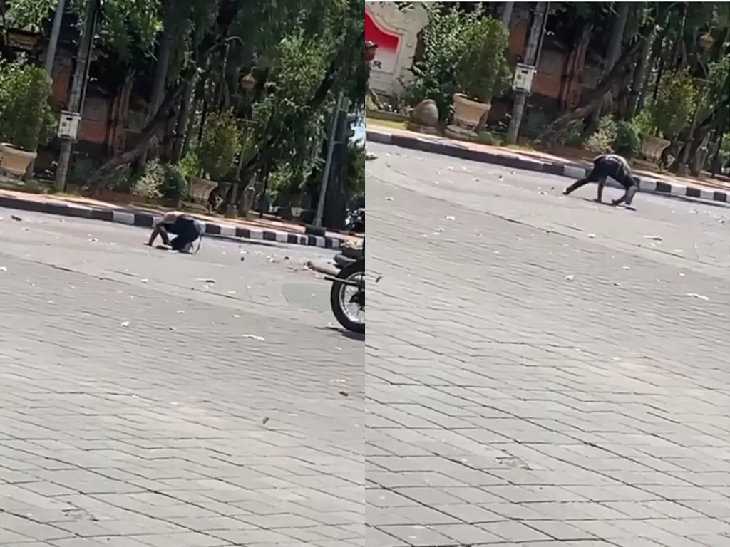 Cuplikan video pria yang diduga mabuk melakukan aksi aneh di tengah jalan. (photo/Instagram/denpasar.viral)