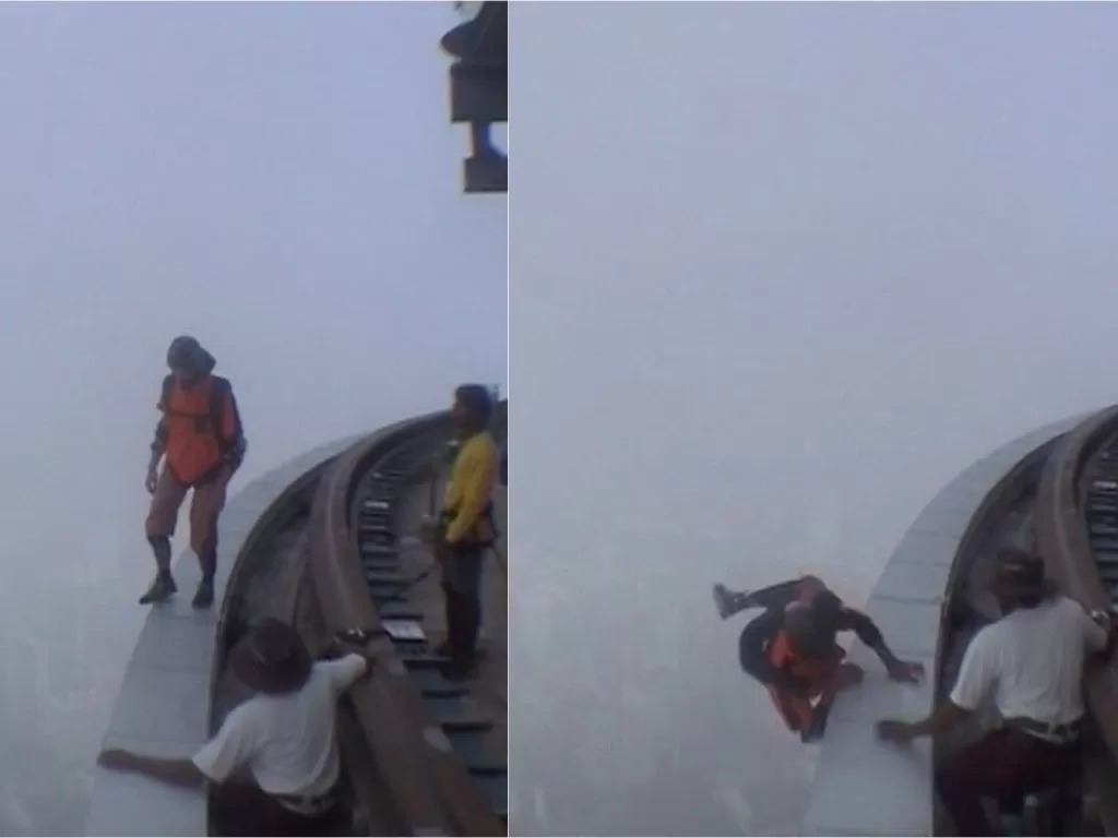 Pria terpeleset di tepian gedung tinggi (Screenshot)