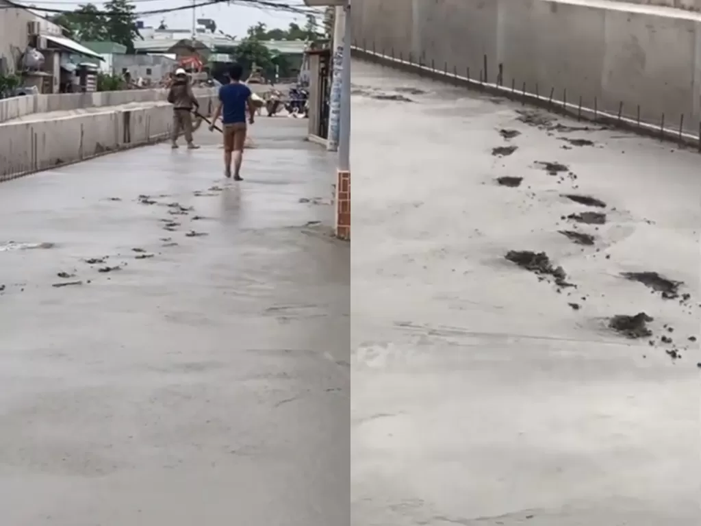 Cuplikan video saat pria yang injak jalan yang masih basah. (photo/Instagram/@makassar_iinfo)