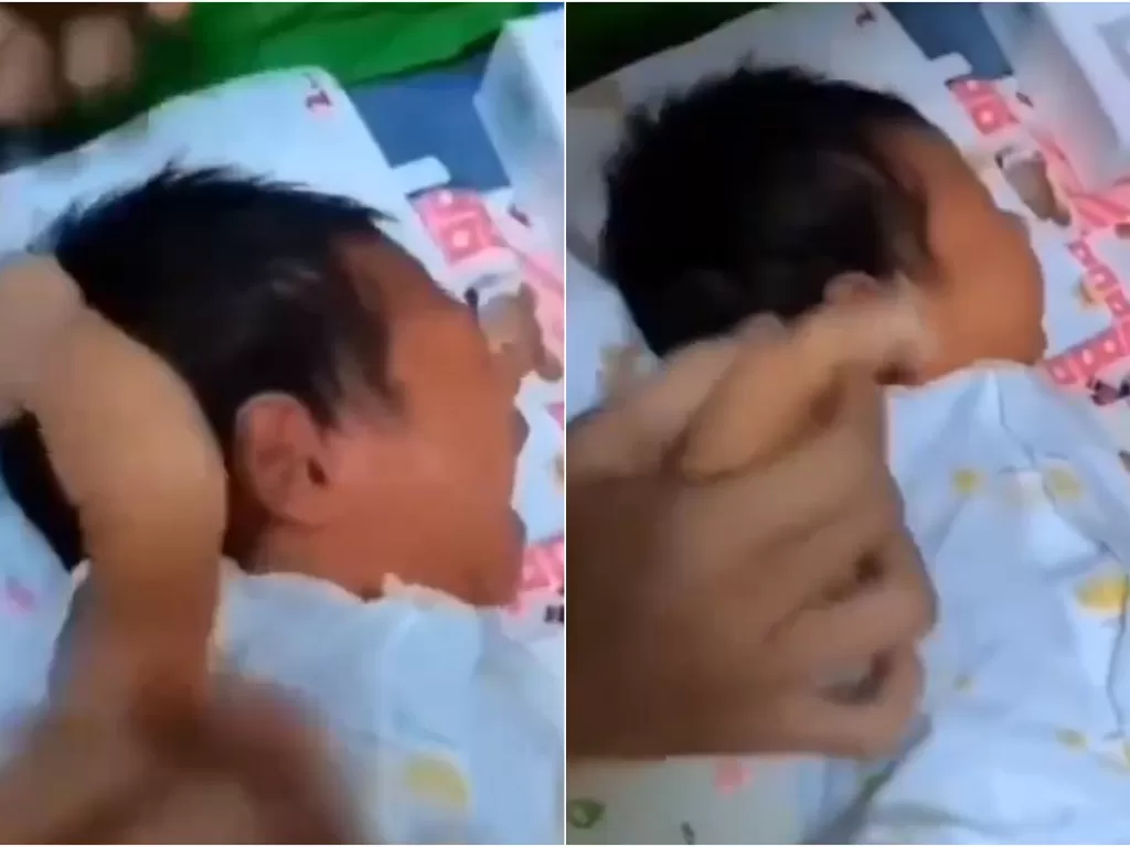 Bayi nangis karena jambak rambut sendiri. (Tangkapan layar)