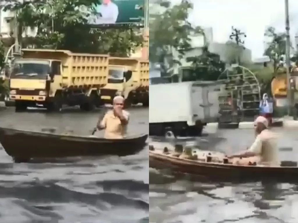 Kakek dayung jukung di jalanan yang terendam banjir (Instagram/ info_kejadian_banjarmasin)
