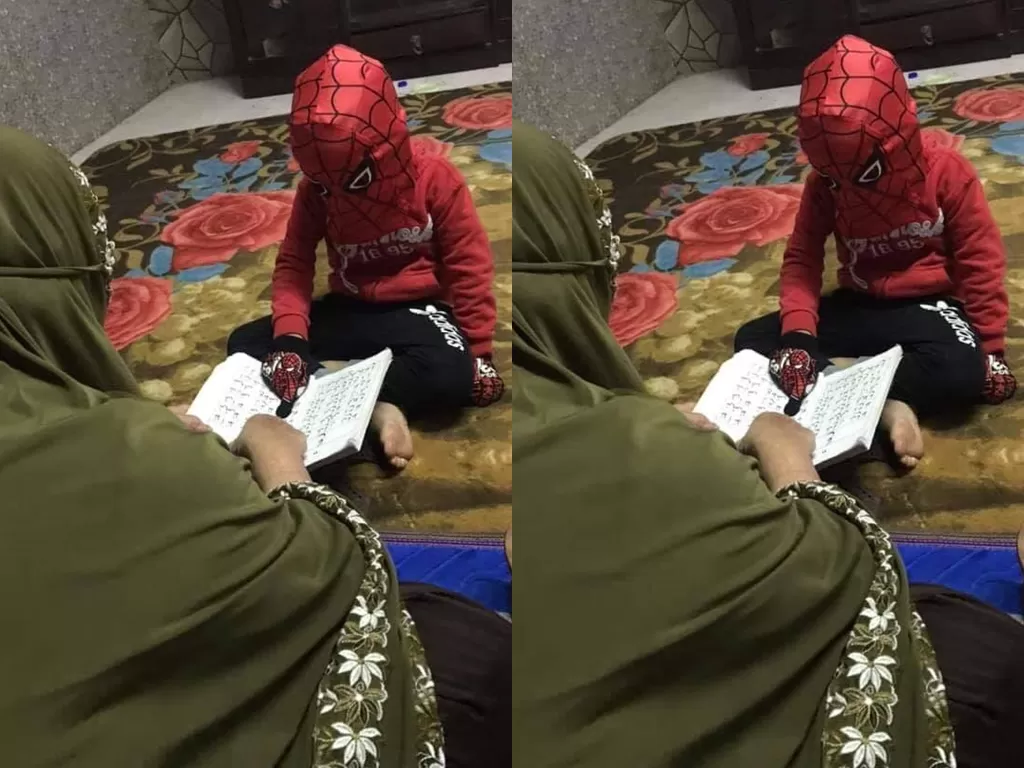 Seorang bocah mengaji dengan menggunakan kostum Spiderman. (Photo/Facebook/Puteri Penyu)
