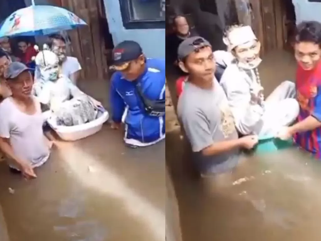 Cuplikan video pengantin diangkut warga terobos banjir di Jakarta (Twitter @windysatria)