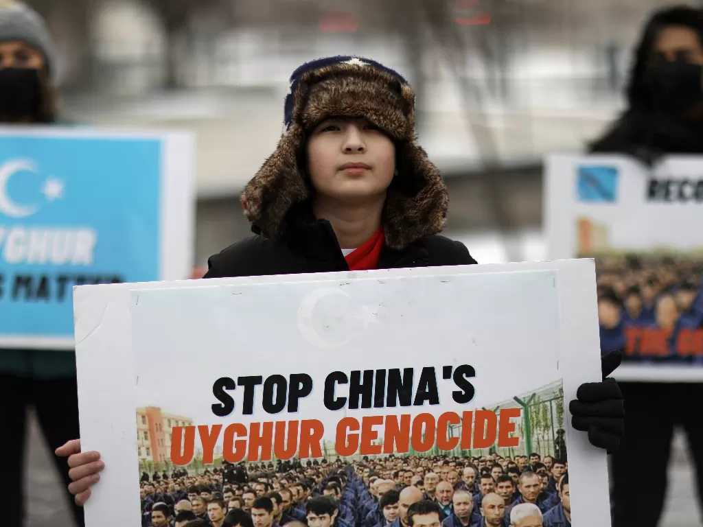 Protes dan demo terhadap Muslin Uighur oleh Tiongkok. (REUTERS/Leah Millis).