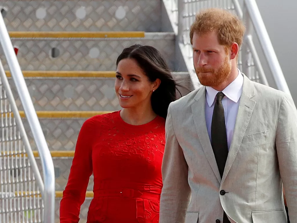 Pangeran Harry dan istrinya, Meghan Markle. (photo/REUTERS/Phil Noble)