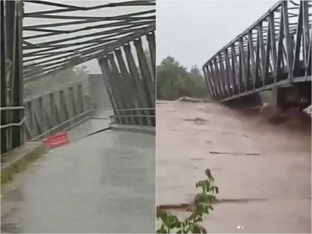 Jembatan Benenain miring dan terputus akibat hempasan arus deras banjir (Instagram/saiful_ulum99)