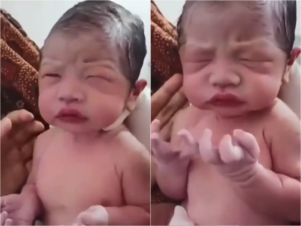 Bayi baru lahir ini mengangkat kedua tangannya seperti berdoa (Instagram/sahabatsurga)