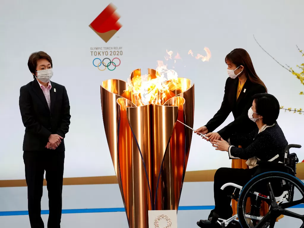 Penyalaan obor Olimpiade Tokyo 2020. (REUTERS/Kim Kyung-Hoon/Pool)