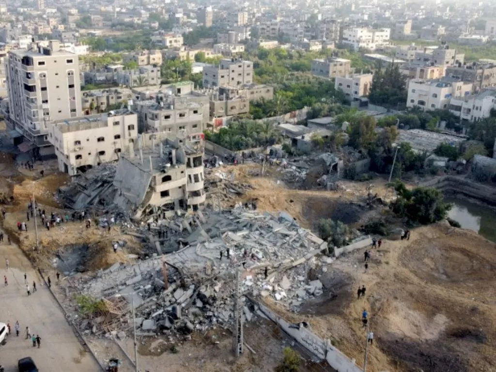 Bangunan rata dengan tanah karena serangan Israel. (REUTERS/Mohammed Salem)