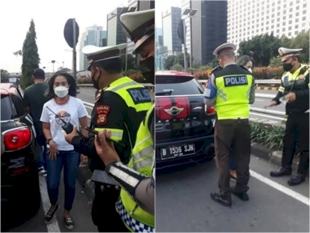 Polisi saat mengamankan seorang wanita pengendara mobil mewah di Exit Tol Semanggi, Jalan Gatot Subroto, Jakarta Selatan. (Instagram/@tmcpoldametro)