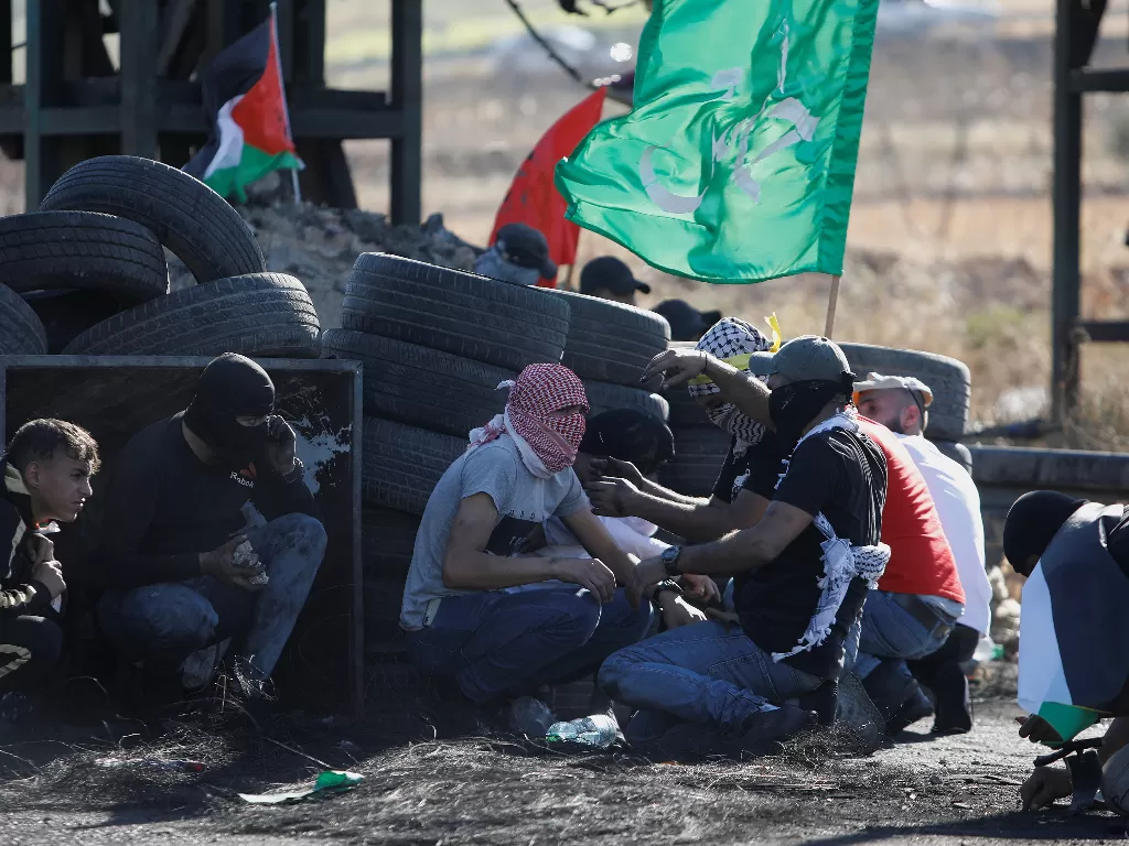 Pertempuran di jalur Gaza, antara Palestina dan Israel. (REUTERS/Raneen Sawafta).