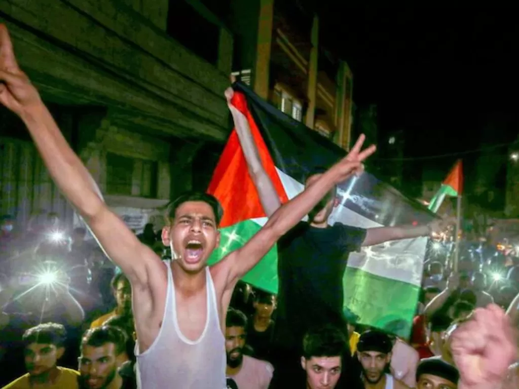 Warga Palestina merayakan kemenangan (Reuters)