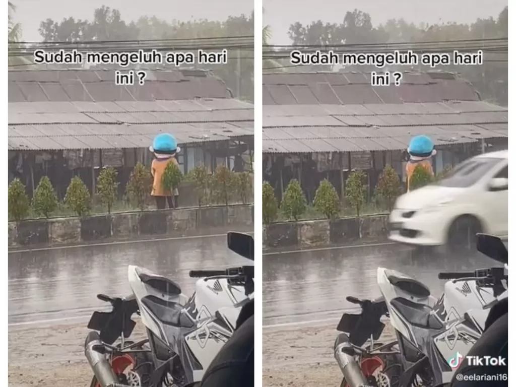 Viral boneka badut tetap semangat cari rezeki saat turun hujan. (TikTok/@eelariani16)