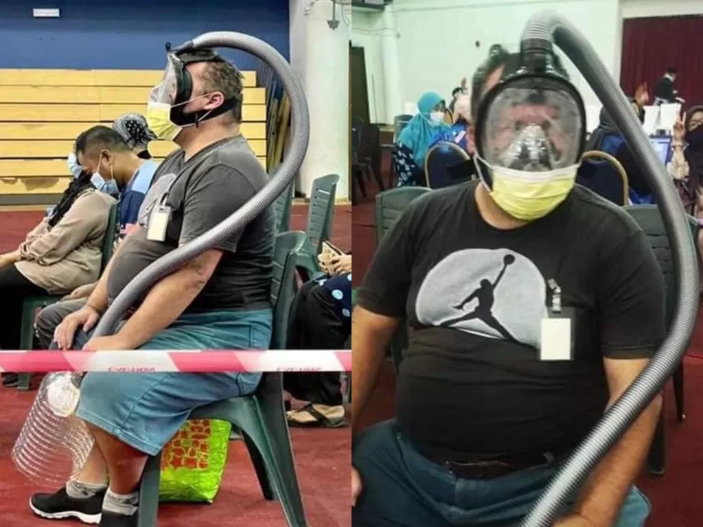 Masker snorkeling dipakai ke pusat vaksinasi. (Photo/Facebook/Viral Perak)