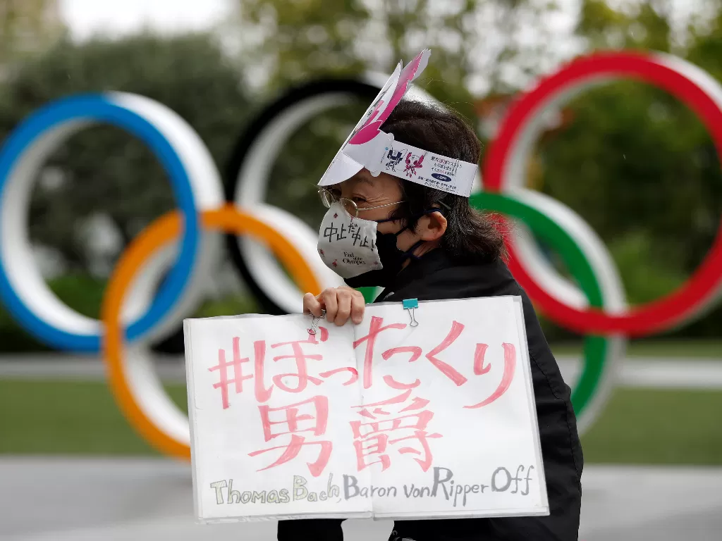 Aksi protes menentang digelarnya Olimpiade (REUTERS/Issei Kato).