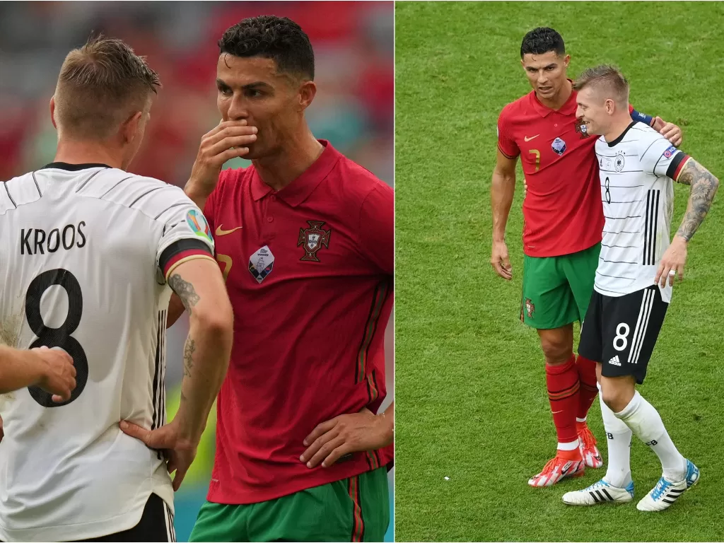 Toni Kroos dan Cristiano Ronaldo di laga Portugal vs Jerman EURO 2020. (photo/REUTERS/MATTHIAS SCHRADER/MATTHIAS HANGST)