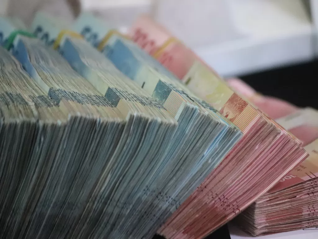Ilustri mata uang rupiah. (photo/Unsplash/Mufid Majnun/ilustrasi)