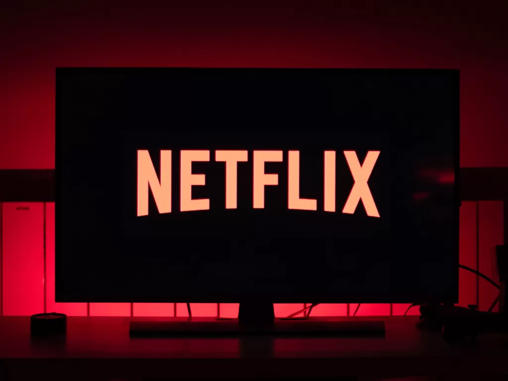 Tampilan logo perusahaan streaming film Netflix (photo/Unsplash/Thibault Penin)