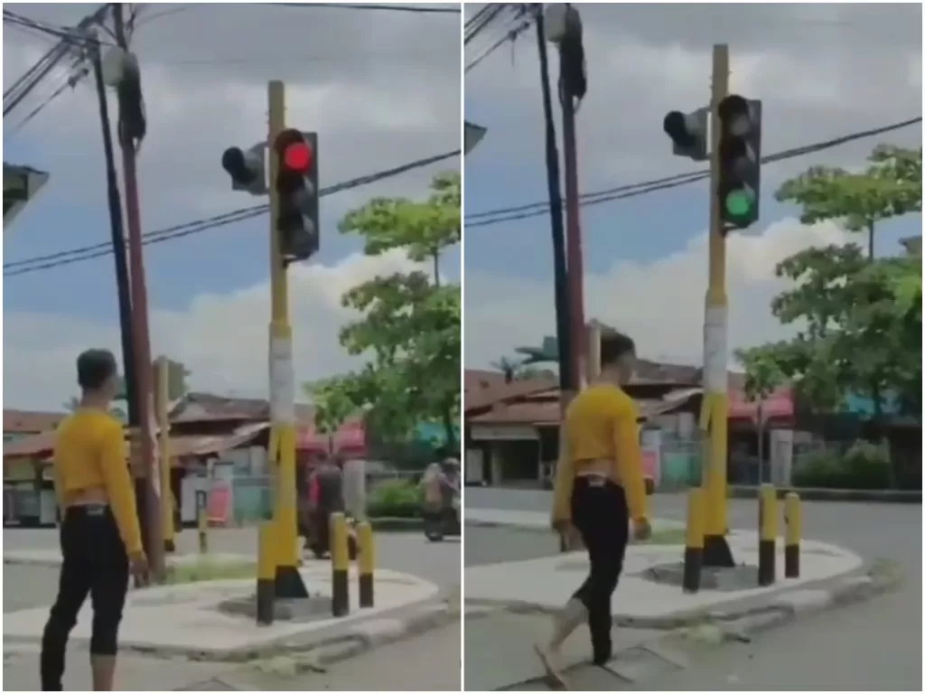 Pria pejalan kaki berhenti di lampu lalu lintas (Instagram/@instalombok_)