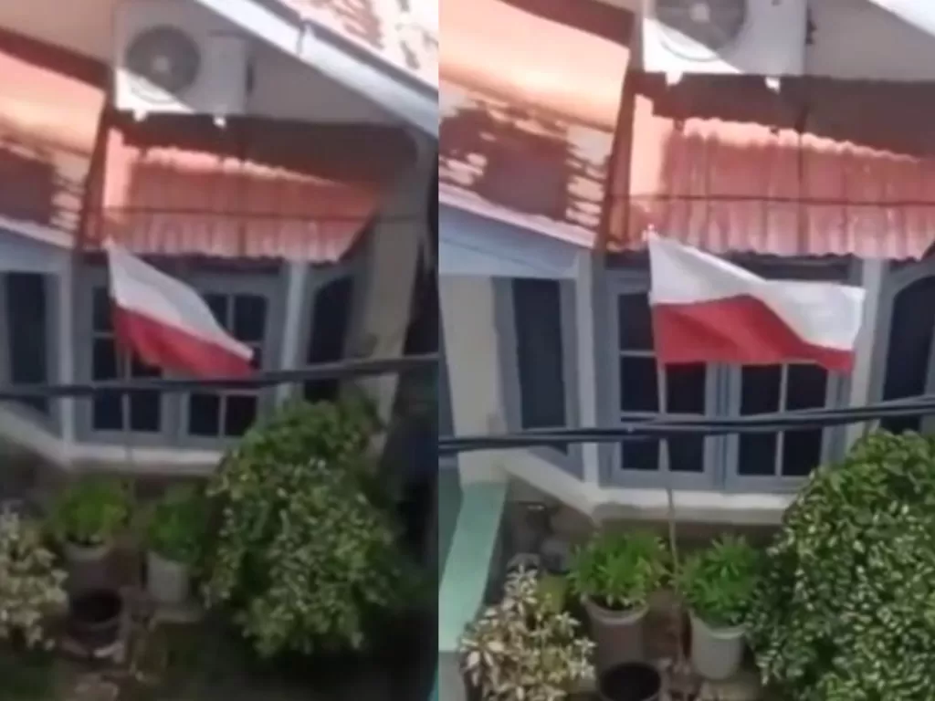 Viral seorang warga mengibarkan bendera merah putih dalam posisi terbalik. (Istimewa)
