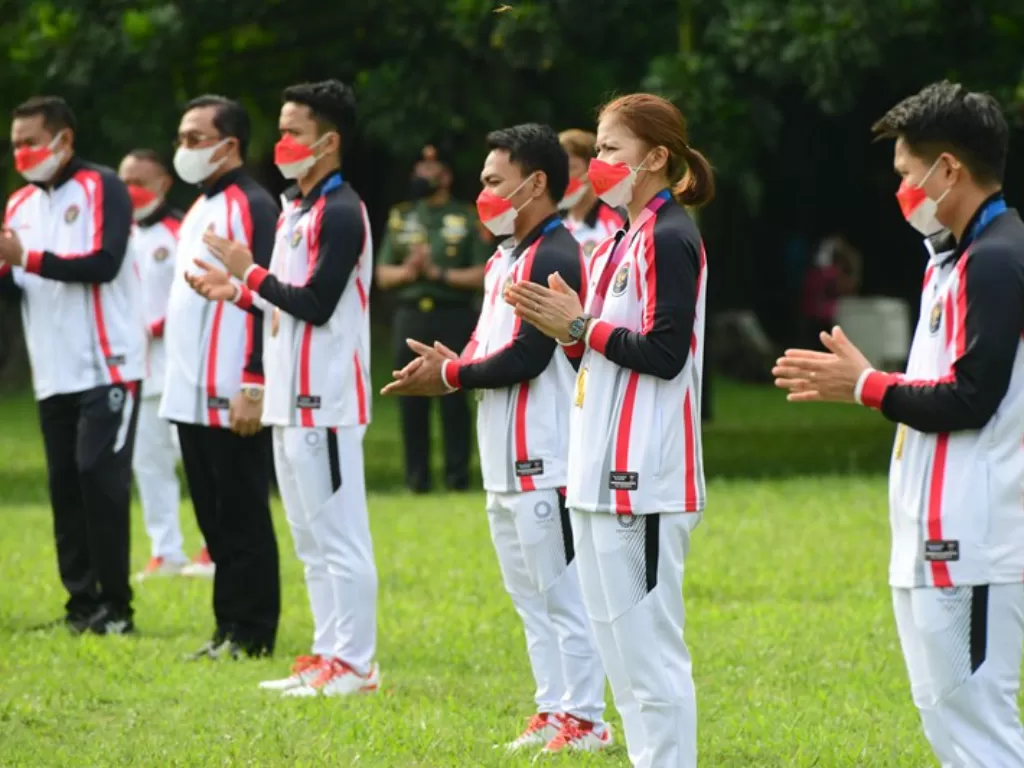 Kontingen Indonesia yang bertanding dalam Olimpiade Tokyo 2020 menghadiri penyambutan kepulangan oleh Presiden Joko Widodo. (ANTARA FOTO/HO/Setpres-Muchlis Jr)