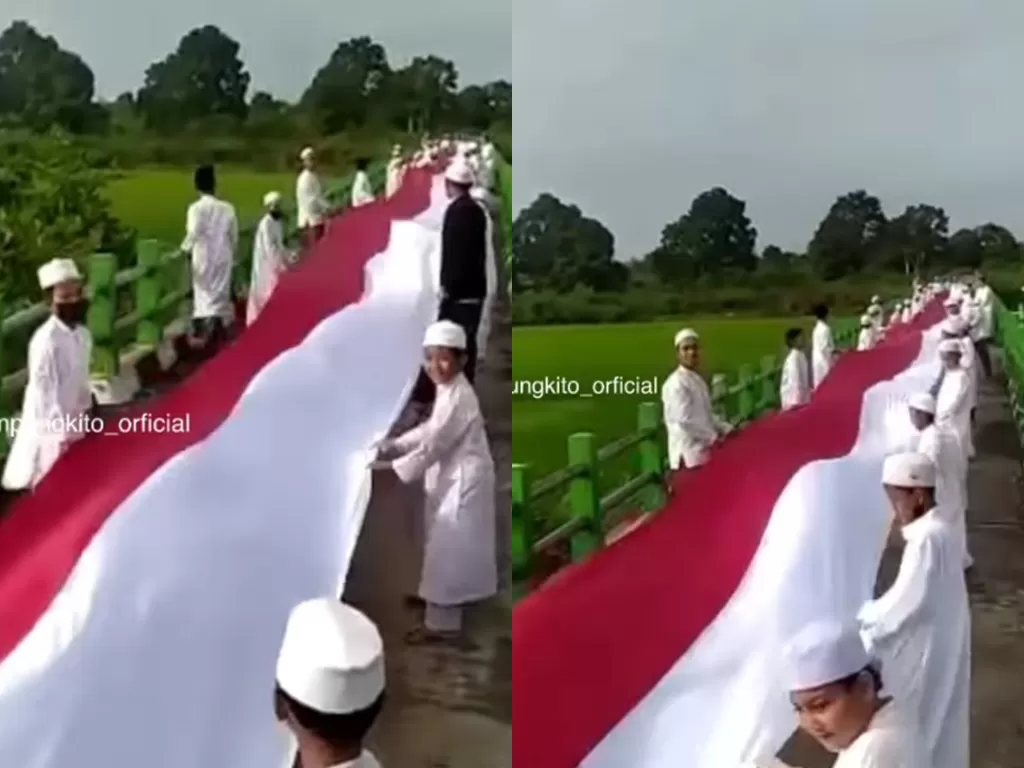 Puluhan warga bentangkan bendera merah putih sepanjang 76 meter di Jambi (Instagram/kabarkampungkito_official)