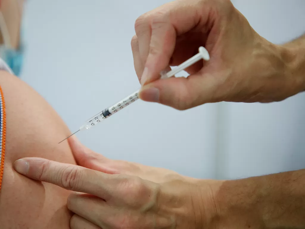 Ilustrasi vaksinasi COVID-19. (photo/REUTERS/Sarah Meyssonnier/ilustrasi)