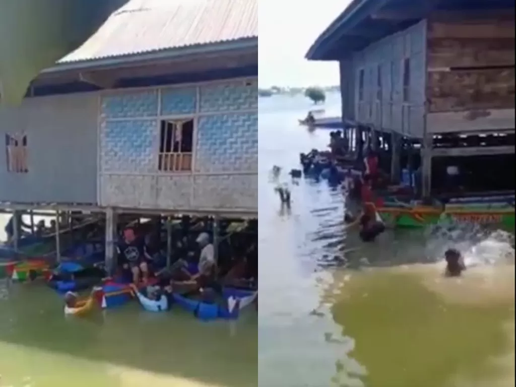 Warga Wajo gotong royong pindahkan rumah pakai perahu (Instagram/andreli48)